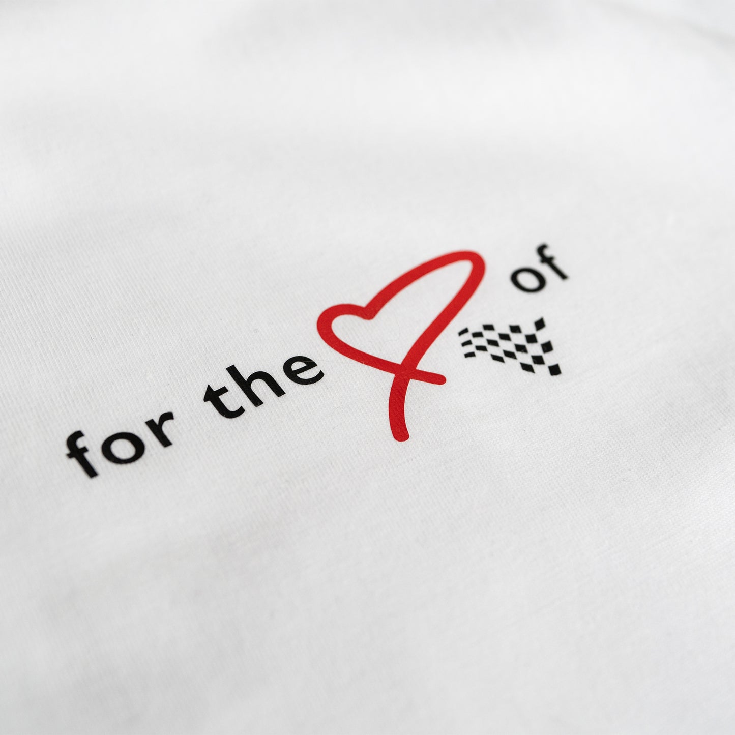 This ‘T’ is the cam of our collection. Featuring our MT brand on the front with for the love of heart and flag, with a larger heart and flag motif on the back. This ‘T’ was designed to convey the love of motorsport.
Why white? It’s a stylish backdrop for the red heart and chequered flag and cooler in the sun. This ‘T’ is inspired by a love of motorsport and is a great tribute to the thrill of the race.
Our t-shirts are soft and durable just like our community.
This ‘T’ is a ladies more snug fit (this run