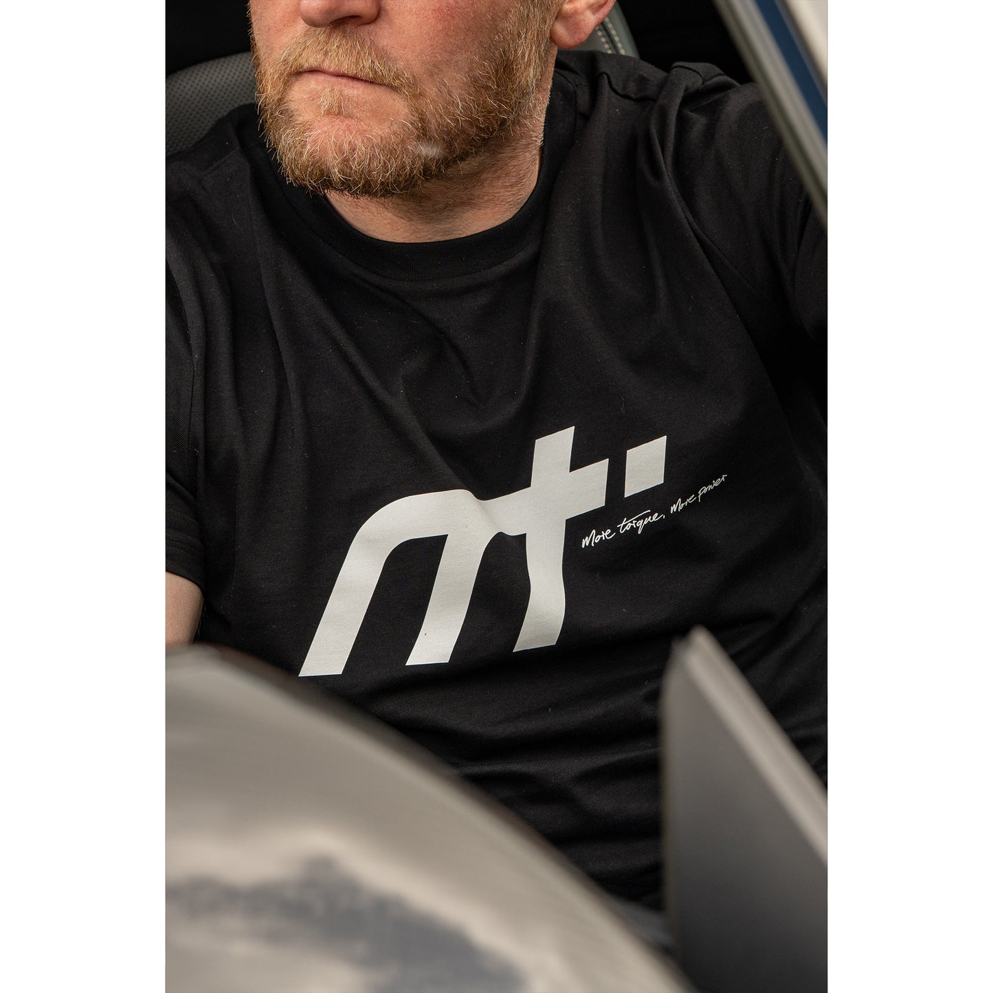 This ‘T’ forms the engine of our collection and is designed to become a longstanding classic. Featuring our MT brand on the front with our philosophy ‘more torque, more power’ vertically rising on the back.
Why black? Well anyone who is around cars knows that motor oil gets everywhere, it makes sense. The ‘T’ that started us makes a statement and conversation starter for anyone in the motor community.
Our t-shirts are soft and durable just like our community.
100% organic combed cotton.