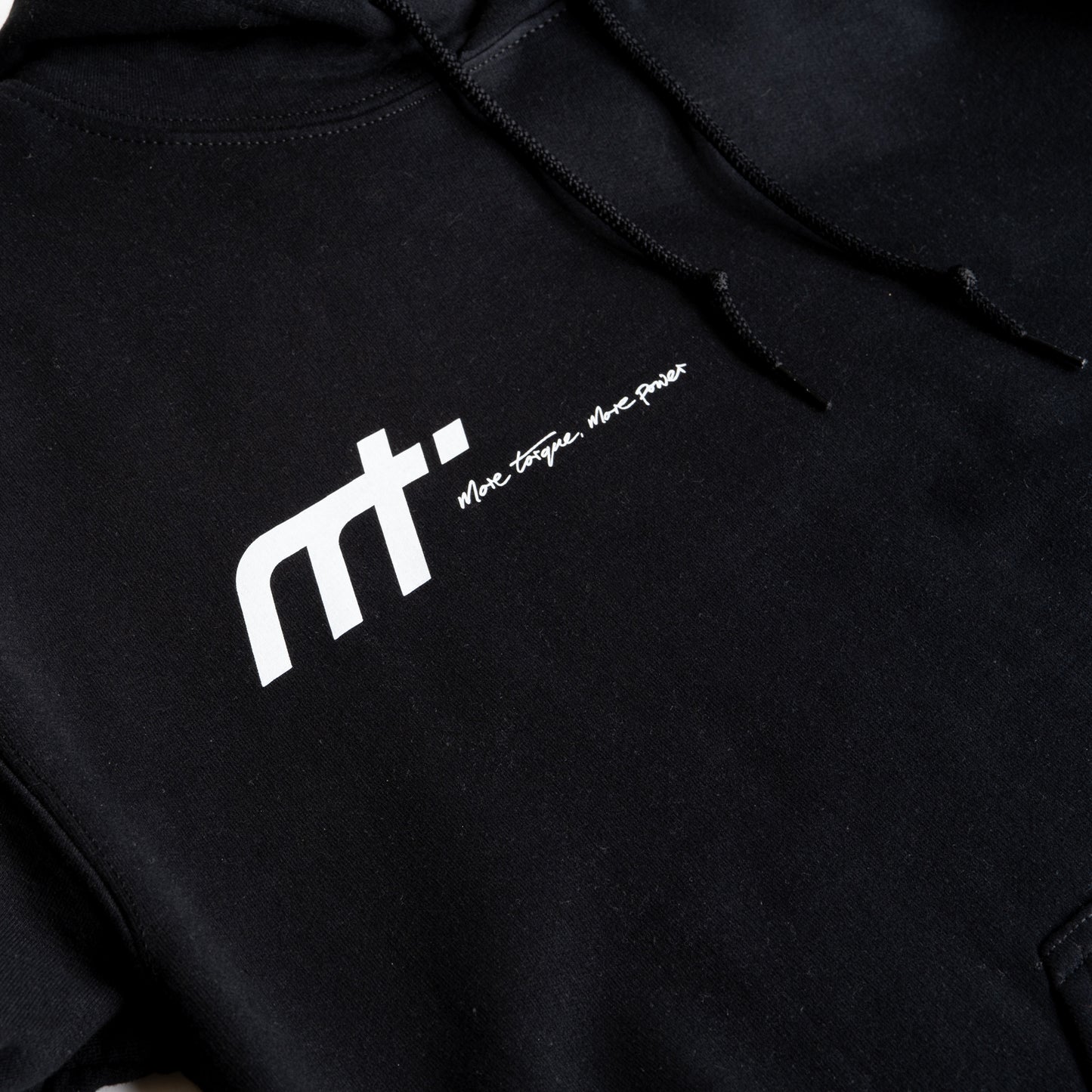 This heavyweight hoodie forms the bonnet of our collection and is designed to become a future classic. Featuring our MT brand on the front with our philosophy ‘more torque, more power’ vertically rising on the back. The names on the hood!

Why black? Well anyone who is around cars knows motor oil gets everywhere. This hoodie makes a sensible choice for anyone around engines. The hoodie that keeps you cosy when our weather thinks otherwise, whilst making a statement and conversation starter for anyone in the