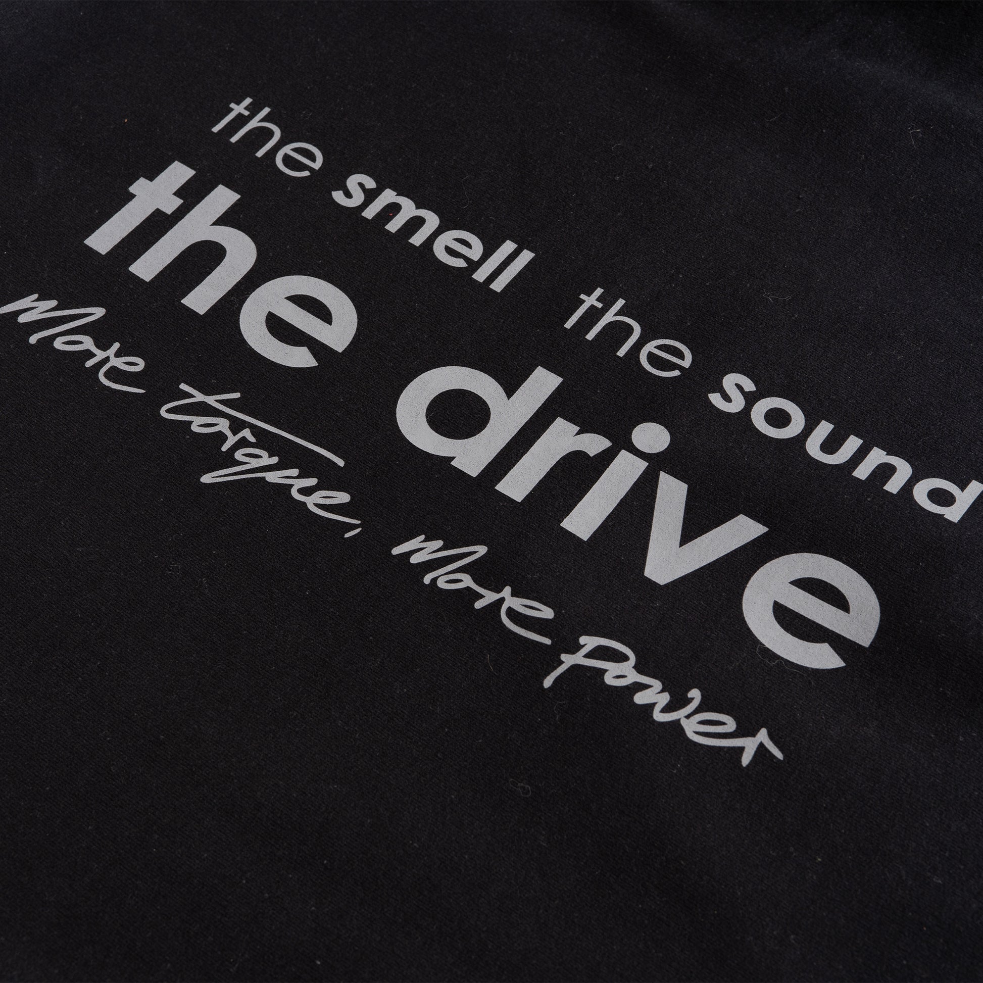 This ‘T’ is the highway of our collection. Featuring our MT brand on the front with 'the smell, the sound, the drive' on the back, a homage to all those that love motors.

Why choose black? Hides oil stains well. The ‘T’ inspired from a genuine love of motors forms the essence of a great conversation starter.

Our t-shirts are soft and durable just like our community.

100% organic combed cotton.
