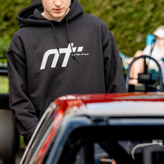 This heavyweight hoodie forms the bonnet of our collection and is designed to become a future classic. Featuring our MT brand on the front with our philosophy ‘more torque, more power’ vertically rising on the back. The names on the hood!

Why black? Well anyone who is around cars knows motor oil gets everywhere. This hoodie makes a sensible choice for anyone around engines. The hoodie that keeps you cosy when our weather thinks otherwise