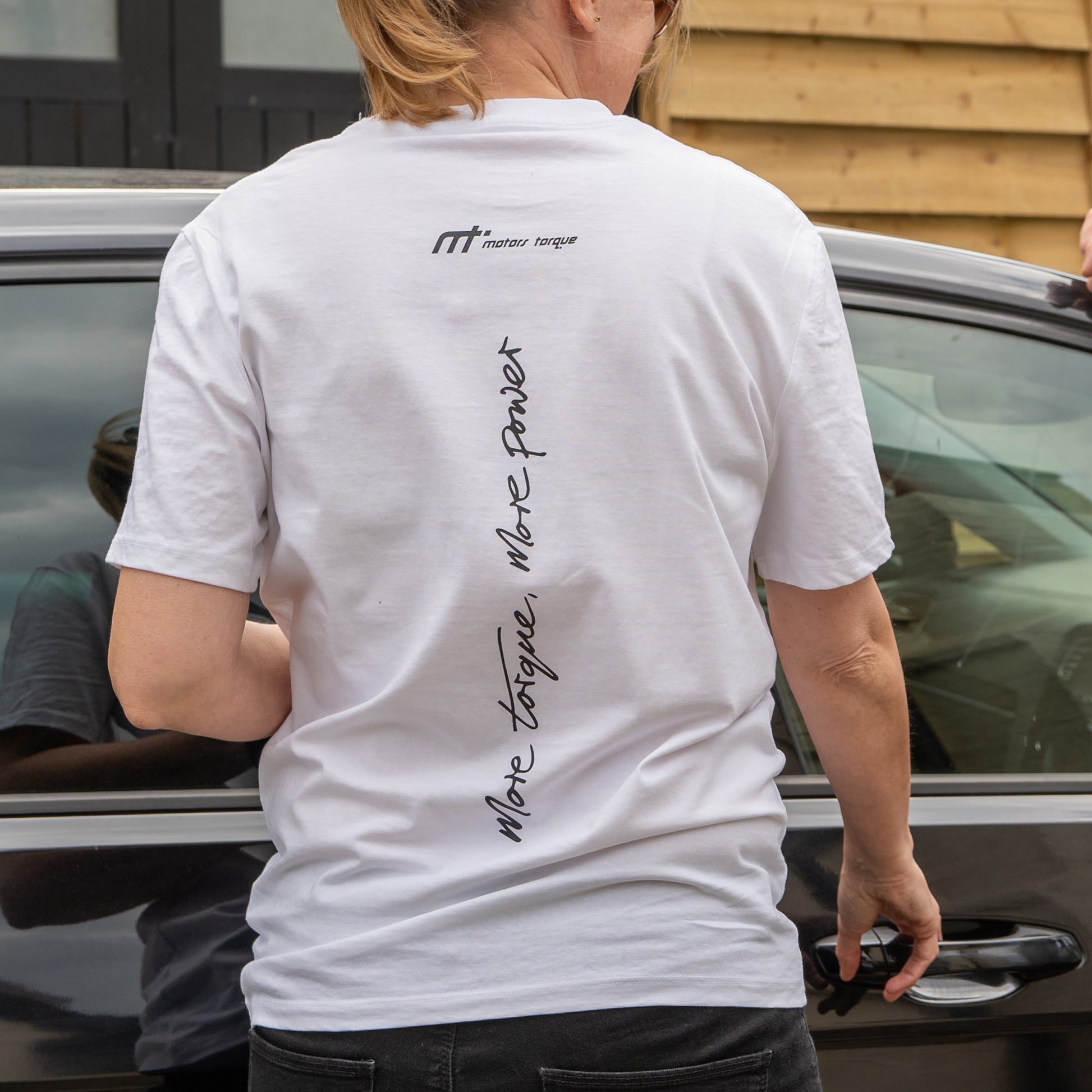 This ‘T’ forms the engine of our collection and is designed to become a longstanding classic. Featuring our MT brand on the front with our philosophy ‘more torque, more power’ vertically rising on the back. Why white? There may be a time you can avoid the oil, great for a cooler summer alternative. The ‘T’ that started us makes a statement and conversation starter for anyone in the motor community.

Our t-shirts are soft and durable just like our community.

100% organic combed cotton.