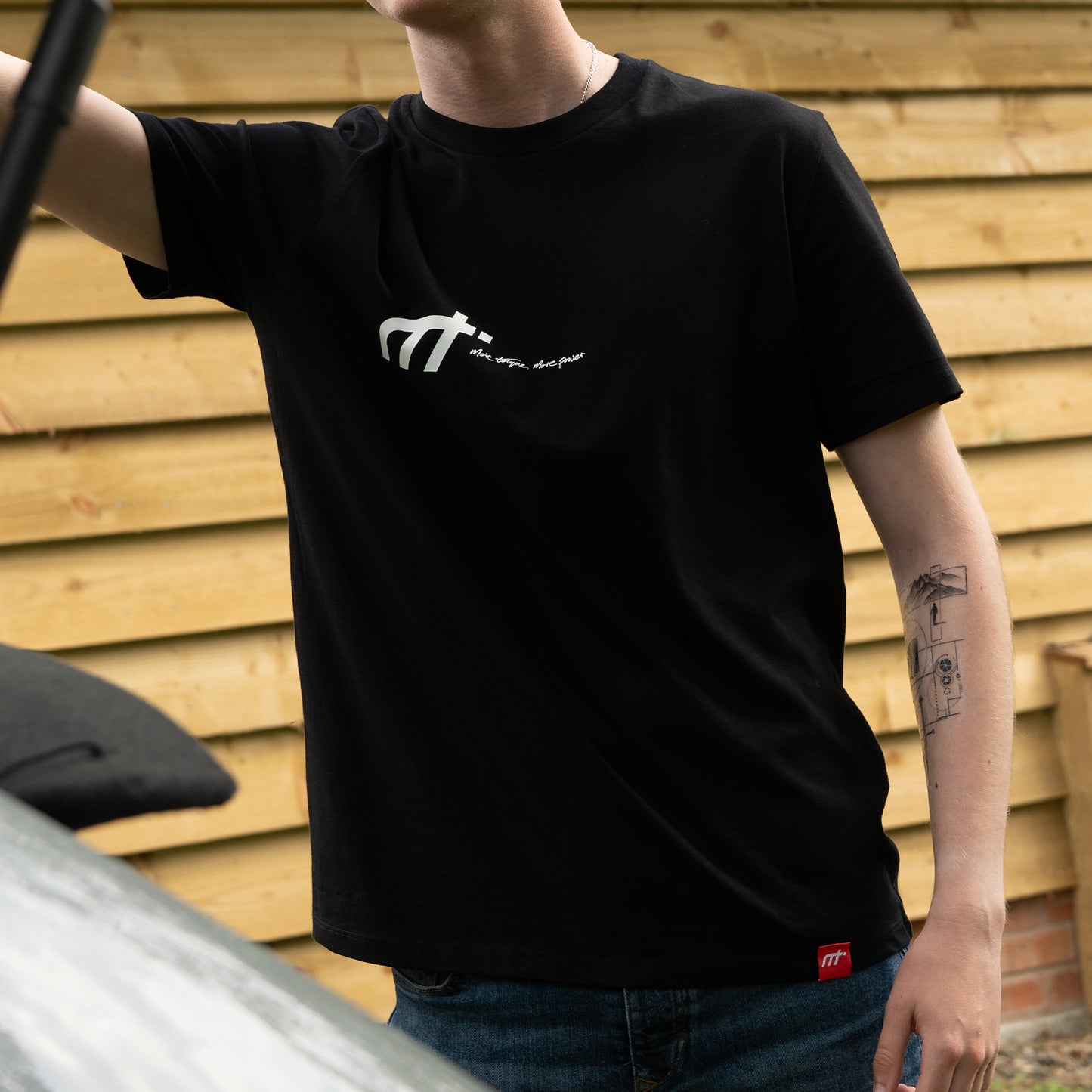 This ‘T’ is the highway of our collection. Featuring our MT brand on the front with 'the smell, the sound, the drive' on the back, a homage to all those that love motors.

Why choose black? Hides oil stains well. The ‘T’ inspired from a genuine love of motors forms the essence of a great conversation starter.

Our t-shirts are soft and durable just like our community.

100% organic combed cotton.